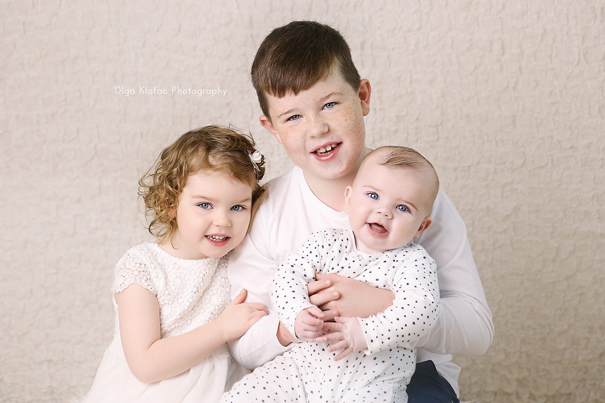 family photo of baby with his brother and sister taken by Olga Klofac baby photographer Sligo